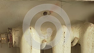 Close up cropped shot of unrecognizable housewife cleaning dirt and dust from iron heating battery with steam cleaner at