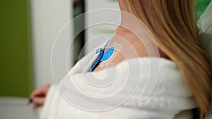 Close-up cropped shot of unrecognizable young woman wearing holter monitor device for daily monitoring of an