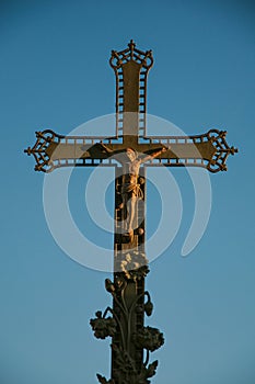 Close-up of cross with blue sky at sunset, in the city center of ChÃÂ¢teauneuf-de-Gadagne.