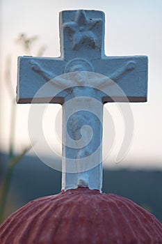Close up from a cross with a picture of Jezus