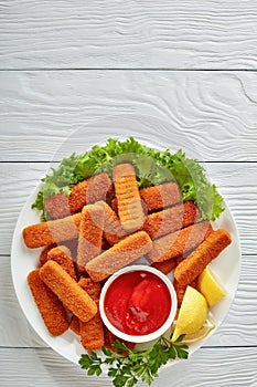 Close-up of crumbed fish sticks, top view