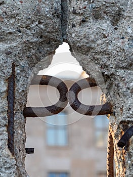 Close up of the crumbling remains of the Berlin Wall at the Wall Memorial, Germany. Segments of wall have been left as a reminder