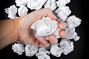 Close-up of crumpled paper in hand of businessman