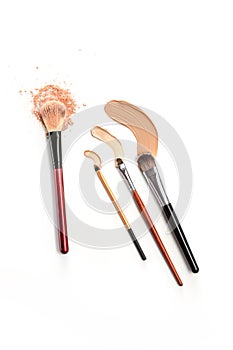 Close-up of crushed mineral shimmer powder golden color with makeup brush