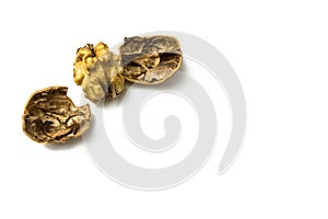 Close-Up Of Crushed Walnuts With Nutshell Isolated On White Background