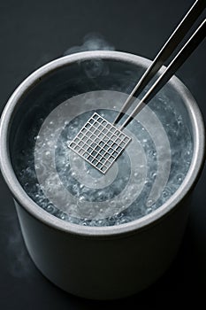 Cryo-EM grid being plunge-frozen in liquid nitrogen