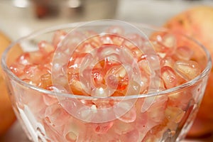 Close-up of crystal goblet with white pomegranate grains ready to be eaten
