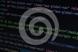 Close up css HTML code on monitor screen with black background