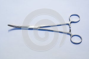 Curved Hemostatic Forceps on White Background photo