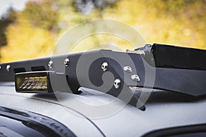 Close up of custom LED side light bar on roof rack off road suv vehicle