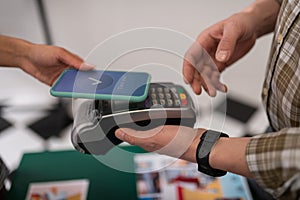 Close-up of a customer doing a successful payment via PayPass