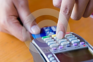 close up customer hand holding and paying for order by credit card in cafe and restaurant.credit card payment service.custumer or