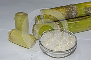 Close Up Cut Pieces Of Sugar Cane,Sugar On Bowl, Isolated On White Background.