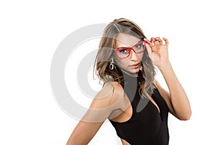 Close-up cute businessgirl in red glasses. fashion and make-up, beauty in business. free space for your text