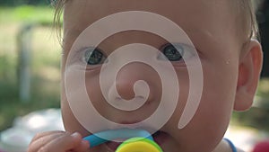 Close-up of a cute caucasian girl. Big beautiful baby eyes. Portrait of a cute baby looking at the camera