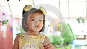 Close up of cute little Asian, Thai, baby girl, 2 years old