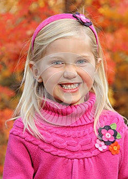 Close up cute little girl in fall