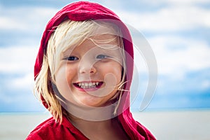 Close-up of cute young boy at the beach