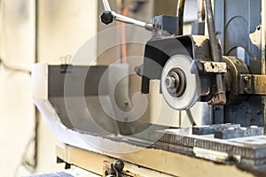 Close up cutting or grinding wheel during rotating or working with product on high accuracy and automatic surface horizontal