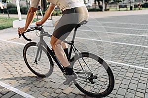 Close up of cyclist biking outdoors during summer time