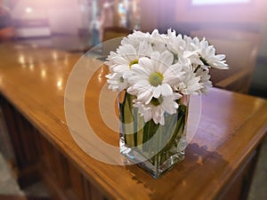 Close up daisy bouquet in vase on table for decorative room and interior,white flower in hotel reception area