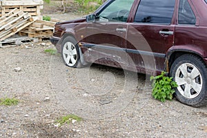 Damaged tire. The wheel of car tire leak. Flat tire on the off-road waiting for repair