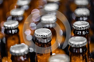 Close up dark beer in glass bottle on Brewery production line industry