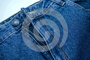 Close up of dark blue old jeans texture background. Blue Jeans texture-gray background