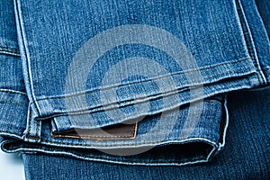 Close up of dark blue old jeans texture background. Blue Jeans texture-gray background