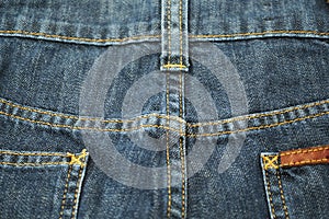 Close up of dark blue old jeans texture background. Blue Jeans texture-gray background