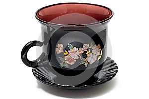 Close-up of dark red dish and cup set