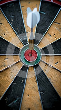 Close Up of Dart Hitting Bullseye in Precise Aim for Success