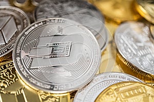 Close-up of dash physical coin on stack of many other cryptocurrencies