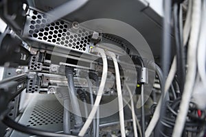 Close-up of data cable plugs connected to servers