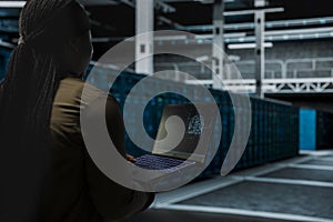 Close up of data center admin using AI assistant to install equipment