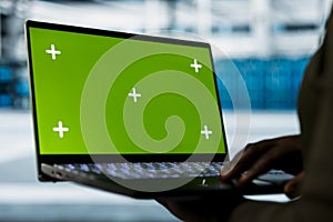 Close up of data center developer using isolated screen laptop