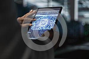 Close up of data center programmer using artificial intelligence on tablet