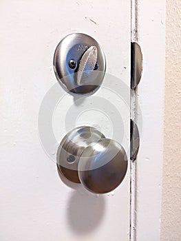 Close up of a deadbolt on the front door of a house photo