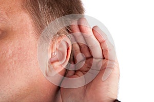 Close up of a deaf man's ear with hearing aid