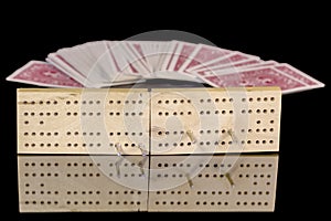 Close up of a deck of Cribbage board with cards