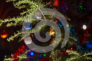 Close up of the decorated christmas tree with colorful balls or baubles