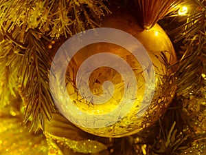 Close-up the decorative single golden christmas ball. : filtere