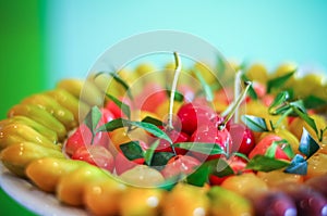 Close up deletable imitation fruits design arrange on plate background, Look Choup Thai sweets