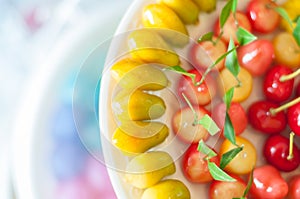 Close up deletable imitation fruits design arrange on plate background, Look Choup Thai sweets