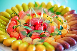 Close up deletable imitation fruits design arrange on plate background, Look Choup Thai sweets