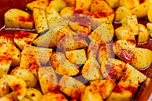 Close up of Delicious baked potatoes with paprika and olive oil