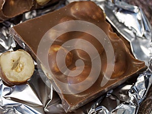 Close up of delicious brown chocolate with nuts.