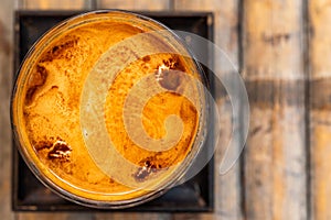 Close-up of a delicious cup of coffee on a bamboo table