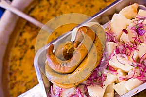 Close up of a delicious ecuadorian traditional typical andean food with morcilla, onions and potato on wooden table