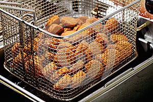 Close-up of delicious Falafel balls in deep fryer